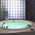 Luxury Circular Spa Bath Surrounded by glass brick wall